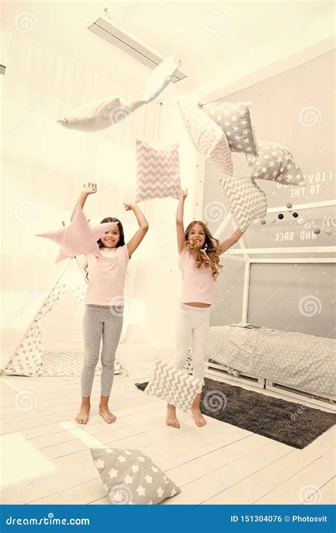 evening time for fun sleepover party ideas sisters play pillows bedroom party pillow fight
