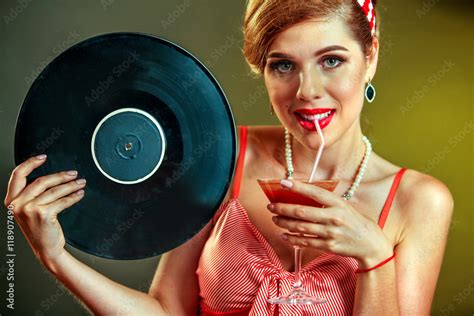 Girl In Pin Up Style Keeps Vinyl Record And Drink Martini Cocktail Pin Up Retro Female Style