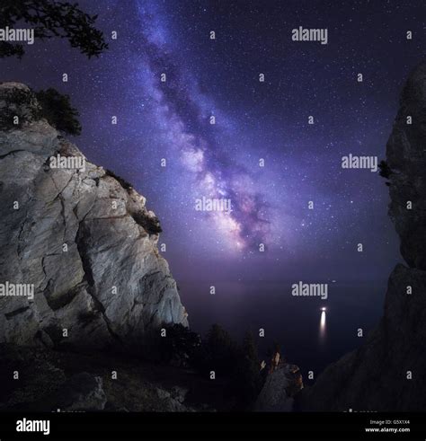 Beautiful Colorful Night Landscape With Milky Way Rocks Sea And