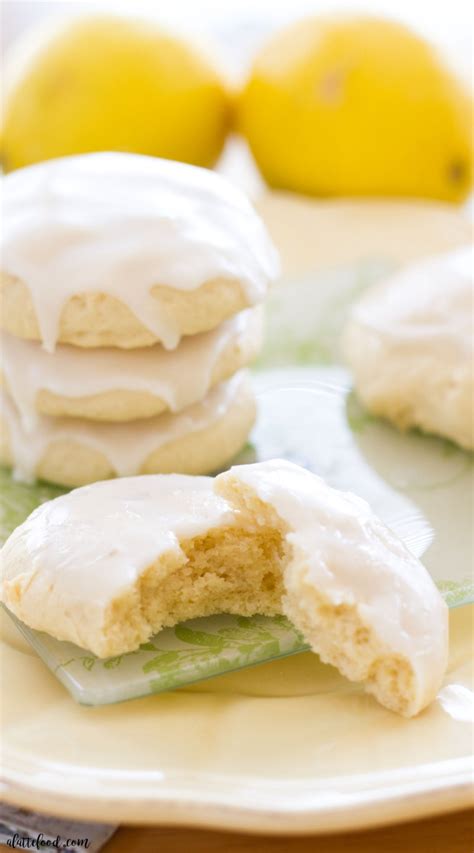 Cream together the butter, sugars, egg, and lemon extract. Lemon Glazed Soft-Baked Sugar Cookies