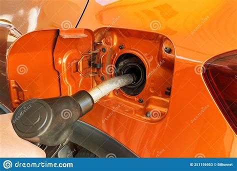 Fill Car With Fuel In Petrol Station Pumping Gasoline Fuel In Orange