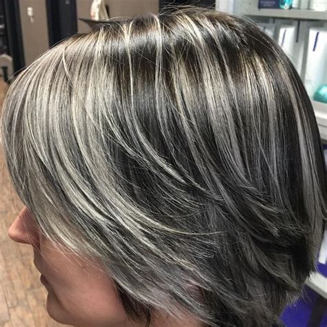 Layer up the gray like this chick by dying it on your upper or lower layers. @designhairteam • Gray hair! Client started with a warm ...