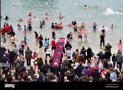 Swimmers And Spectators At The New Years Day Dip In Newquay Harbour