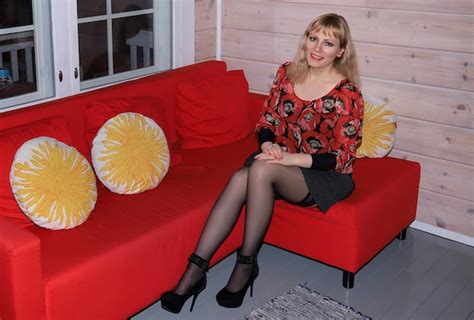 premium photo legged blonde girl in black stockings and black miniskirt posing on sofa person