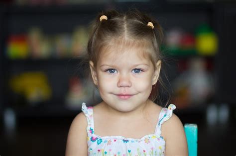 Premium Photo Portrait Of Cute Little Girl Looking At Camera