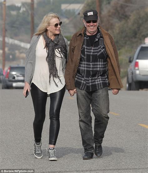 Daryl Hannah Looks Overjoyed As Neil Young Lovingly Takes Her Hand In