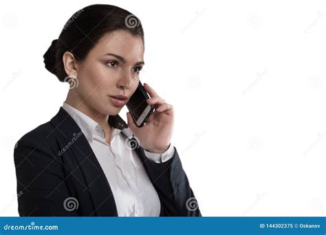 Portrait Of Serious Pretty Businesswoman Talking On The Phone In Modern