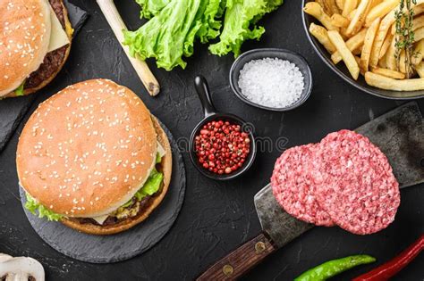 Burger And The Fresh Ingredients On Black Background Flat Lay Stock