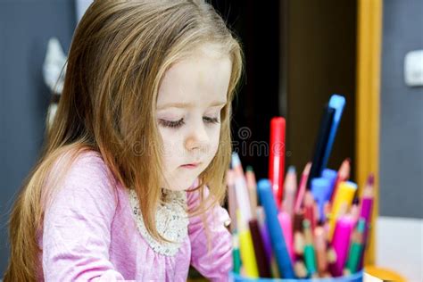 Cute Little Girl Studing To Speaking And Writing Letters At Home Stock