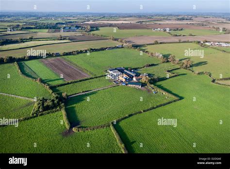 Aerial View Of A Farm Set Amongst Agricultural Land In Somerset Uk