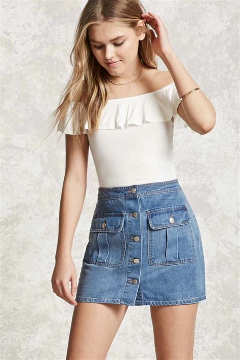 A Denim Mini Skirt Featuring A Button Front Two Front Button Flap