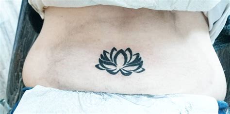 Beautiful Lotus Lower Back Tattoo Blurmark