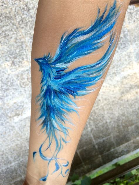 Blue Ink Flying Phoenix Tattoo On Forearm Tatuajes De Plumas Diseño