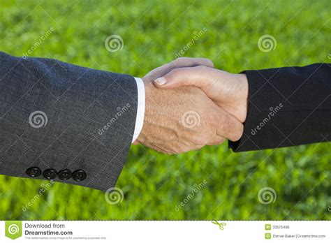 Businessman Man And Woman Businesswoman Handshake Shaking Hands Stock