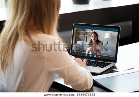 Young Girl Student Woman Holding Educational Video Call With Teacher On