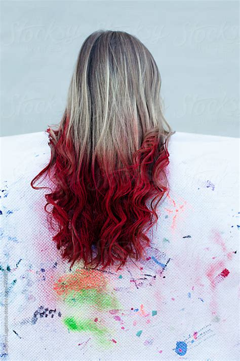 Long Blonde Hair With Red Color Sprayed On The Ends Dip