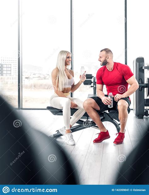 Fitness Couple Drinking Water In Gym Stock Image Image