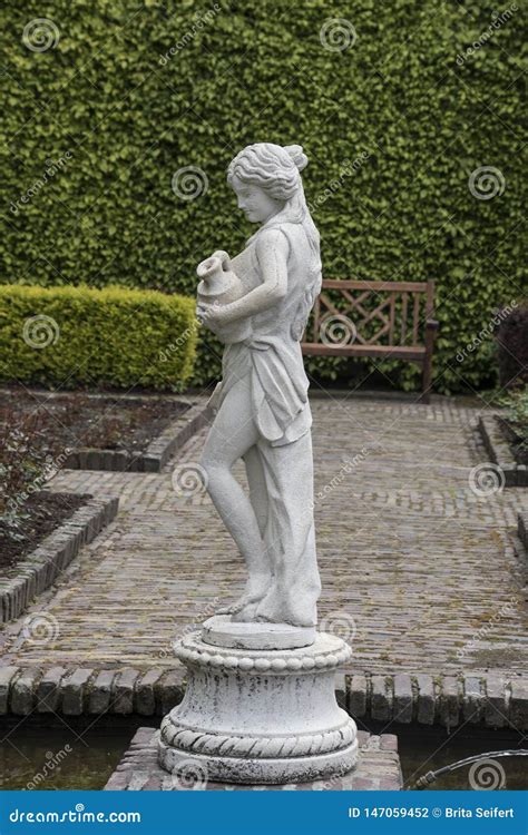 medieval sensual female sculpture in the gardens of castle of arcen netherlands editorial