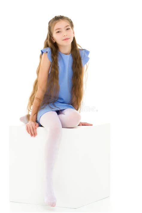 Little Girl Sitting White Cube Cross Legged Stock Photos Free