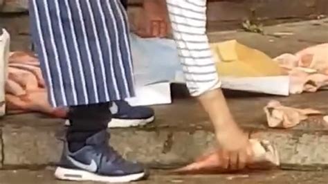 Disgusting Moment Fishmonger Repeatedly Throws Frozen Seafood Down On