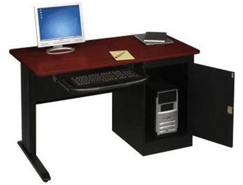 An Office Desk With A Computer On It And A Phone In Front Of The Monitor