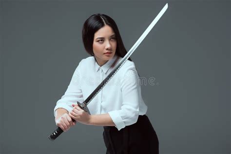 beautiful asian girl holding katana sword and looking away stock image image of copyspace