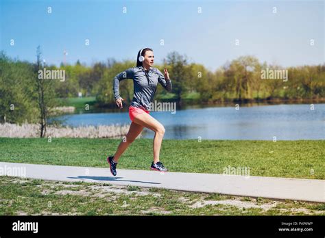 Female Jogger Running At Park Stock Photo Alamy