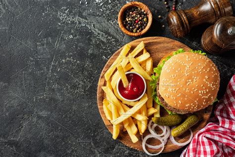 Burger And Fries On Wooden Board High Quality Food Images Creative