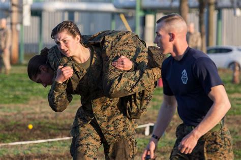 1st integrated company of men and women graduates from marine corps boot camp good morning america