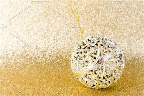 Golden Ball On Glitter Gold Texture Containing Background Christmas