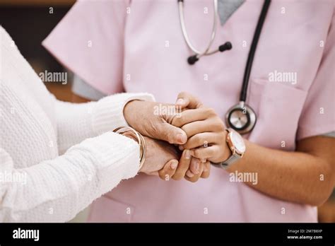 Support, empathy and nurse holding hands with patient for compassion