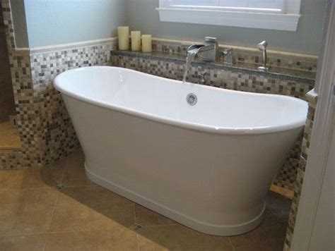 Soaking tubs come in different types. This deep free-standing soaker tub fills in style with our ...