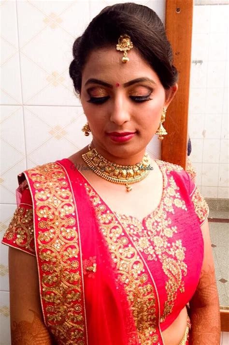 Suitable hair and face type: Indian bride Divya wears bridal lehenga and jewellery for her reception. Makeup and hairstyle by ...