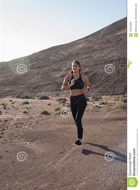 Woman Running With A Mountain Behind Her Stock Photo Image Of Leisure