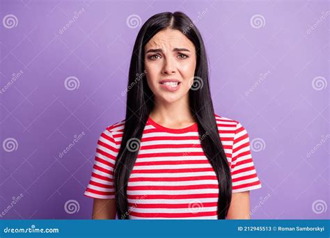 Photo Of Worried Guilty Girl Bite Lips Frowning Look Camera Wear Striped Red Shirt Isolated