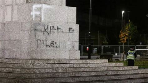 Police Guard Memorial In Rochdale After It Was Daubed With Free
