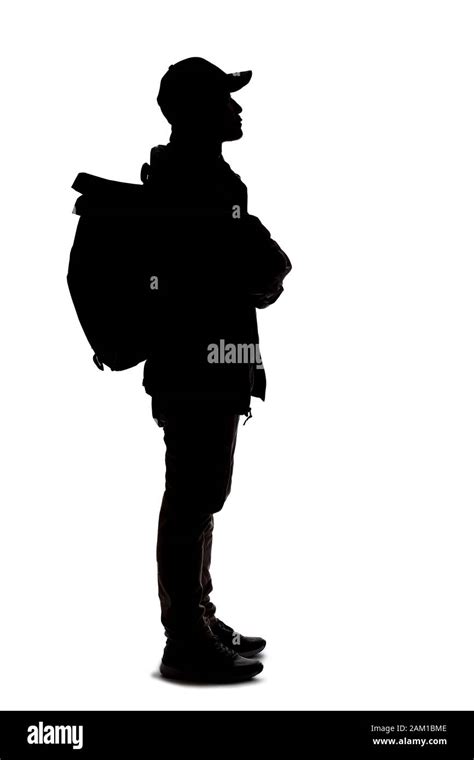 Silhouette Of A Man Hiking And Carrying A Backpack On A White
