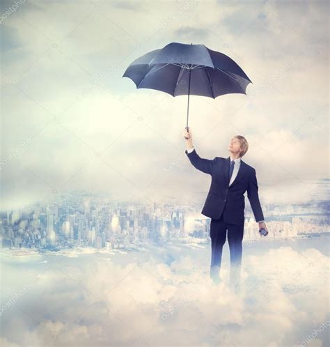 Depositphotos13192199 Stock Photo Business Man Holding An Umbrella Lancr