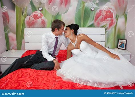 Romantic Kiss Happy Bride And Groom In Bedroom Stock Photography