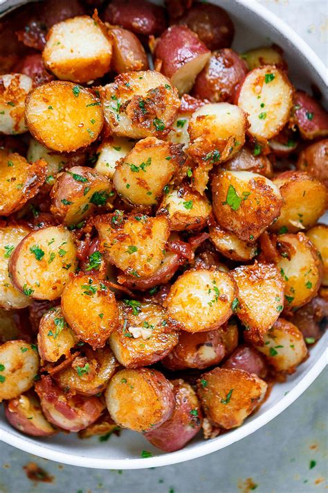 Place potatoes and garlic into a large saucepan full of cold water. Roasted Garlic Potatoes with Butter Parmesan - Best ...