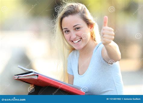Happy Student With Thumbs Up Looks At Camera Stock Photo Image Of