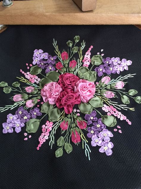 A Bunch Of Flowers That Are Sitting On A Piece Of Cloth In The Shape Of