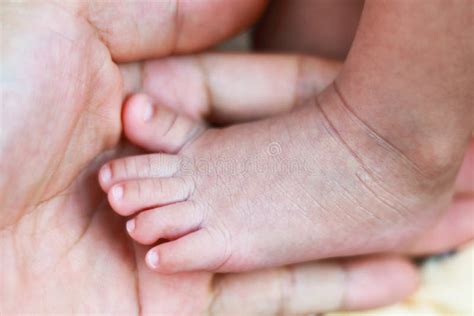 Newborn Baby Foot On Parents Hand Stock Photo Image Of People Father