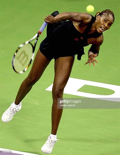 Us Player Venus Williams Serves To Her Sister Serena Williams During