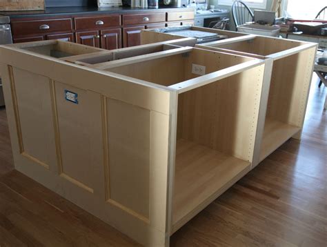 Features include two adjustable shelves in each cabinet door, three storage drawers, towel bar, and spice rack. IKEA Hack {how we built our kitchen island} - Jeanne Oliver | Build kitchen island, Kitchen ...