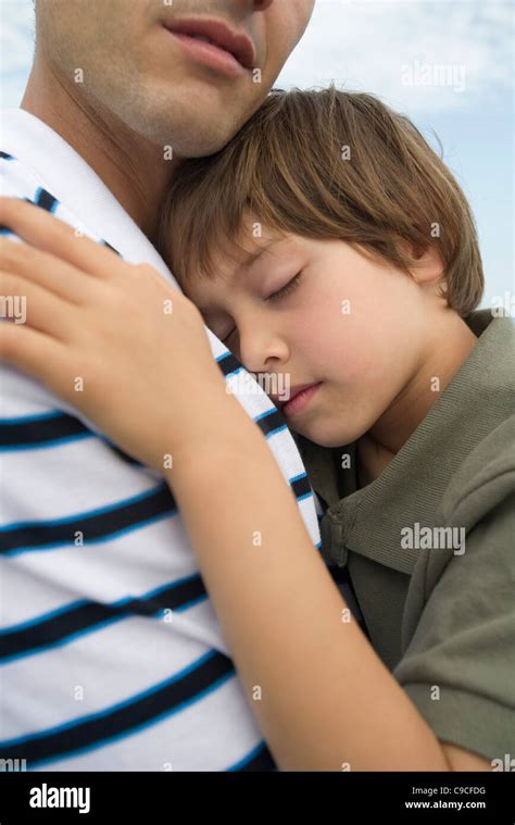 Father And Young Son Embracing Cropped Stock Photo Alamy