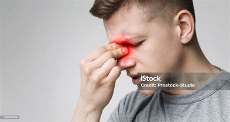 Young Man Suffering Inflamed Nose Panorama With Free Space Stock Photo