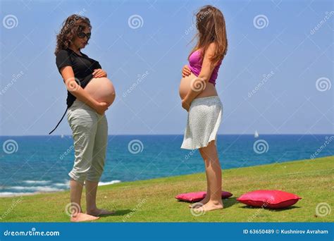 Two Young Pregnant Woman Posing By The Sea Stock Image Image Of