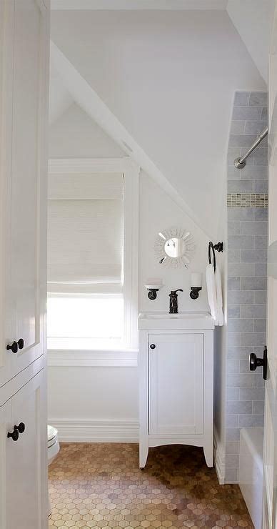 Price and stock could change after publish date, and we may make money from these links. Chic attic bathroom features a sloped ceiling over a tiny ...