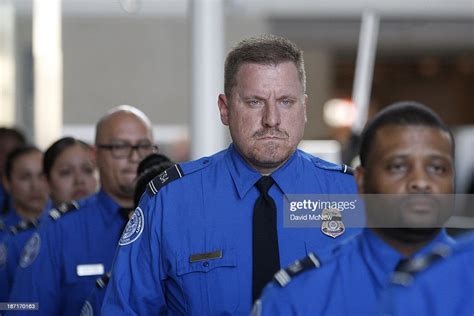 Tsa Officers Walk Through Terminal 4 As Part Of An Honor Guard Escort